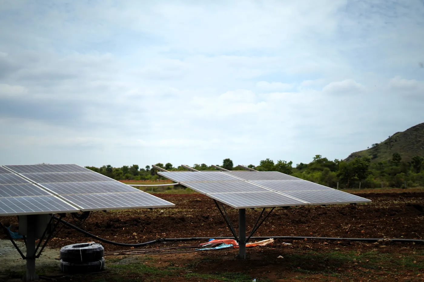 Solar panels powering irrigation pumps at the farmland project